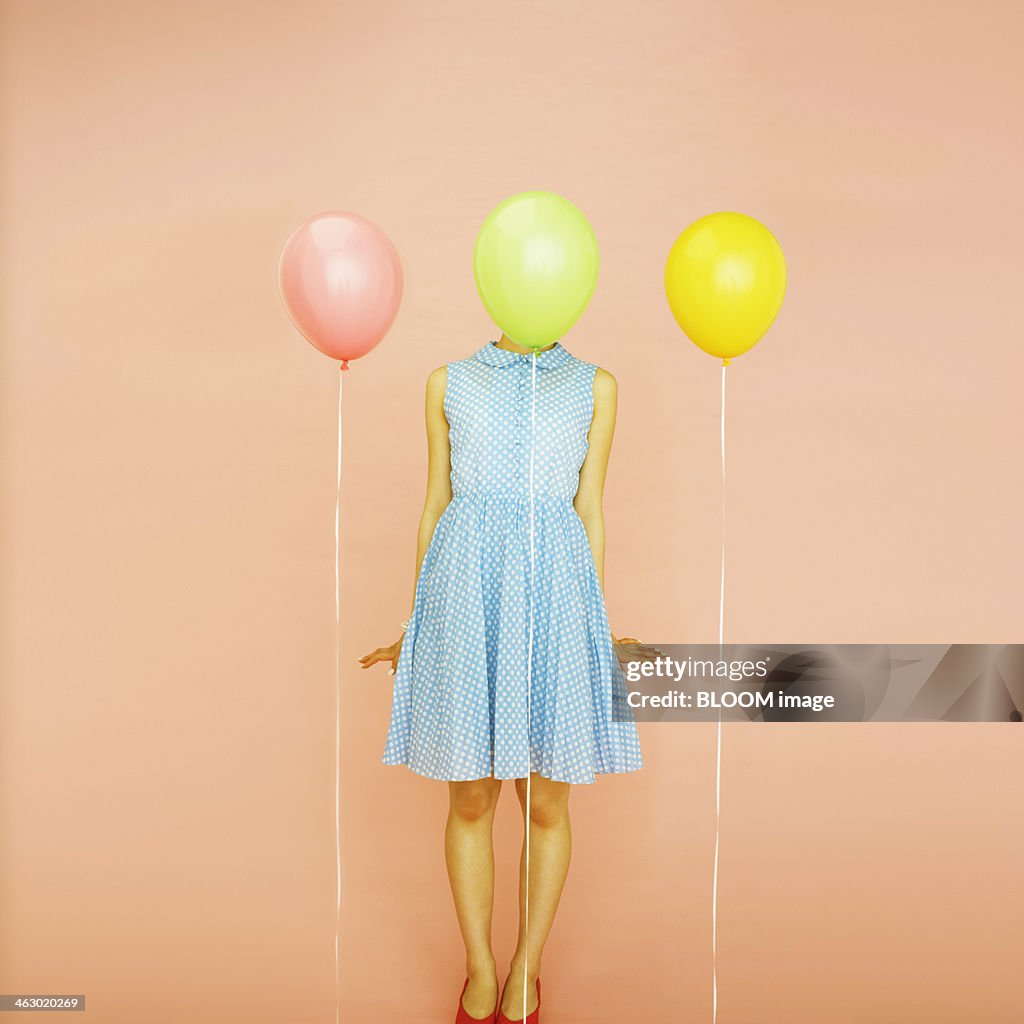 Woman Standing Behind Balloon