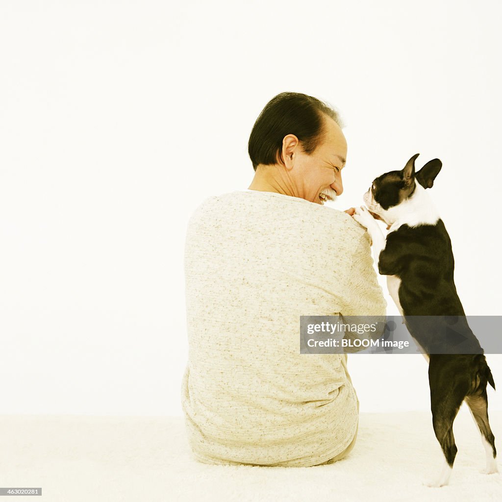 Man Playing With His Dog