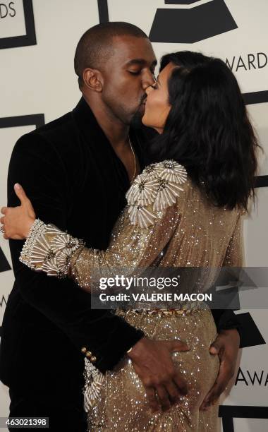 Kanye West and Kim Kardashian arrive on the red carpet for the 57th Annual Grammy Awards in Los Angeles February 8, 2015. AFP PHOTO / VALERIE MACON