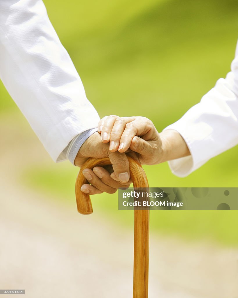 Senior Couple Holding Walking Stick