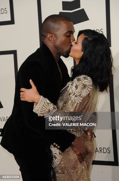 Kanye West and Kim Kardashian arrive on the red carpet for the 57th Annual Grammy Awards in Los Angeles February 8, 2015. AFP PHOTO / VALERIE MACON