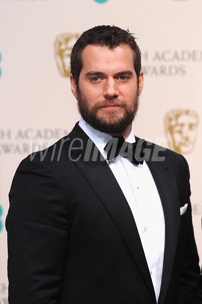 Henry Cavill poses in the...