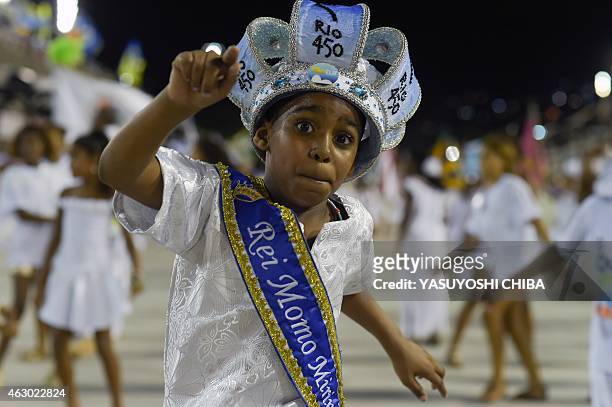 Child member of the Afro-American Candomble religion takes part in a cleansing ceremony of the Sambodrome in Rio de Janeiro, Brazil, on February 8,...