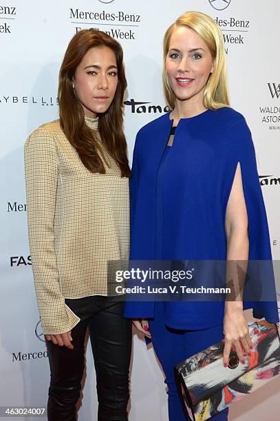 Judith Rakers and Angela Gessmann attend the Laurel show during Mercedes-Benz Fashion Week Autumn/Winter 2014/15 at Brandenburg Gate on January 16,...