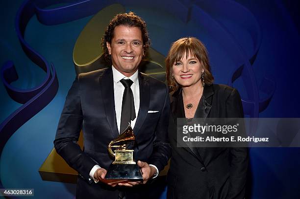 Winner of Best Tropical Latin Album Carlos Vives and Chair of the National Board of Trustees of the Recording Academy Christine Albert pose at the...