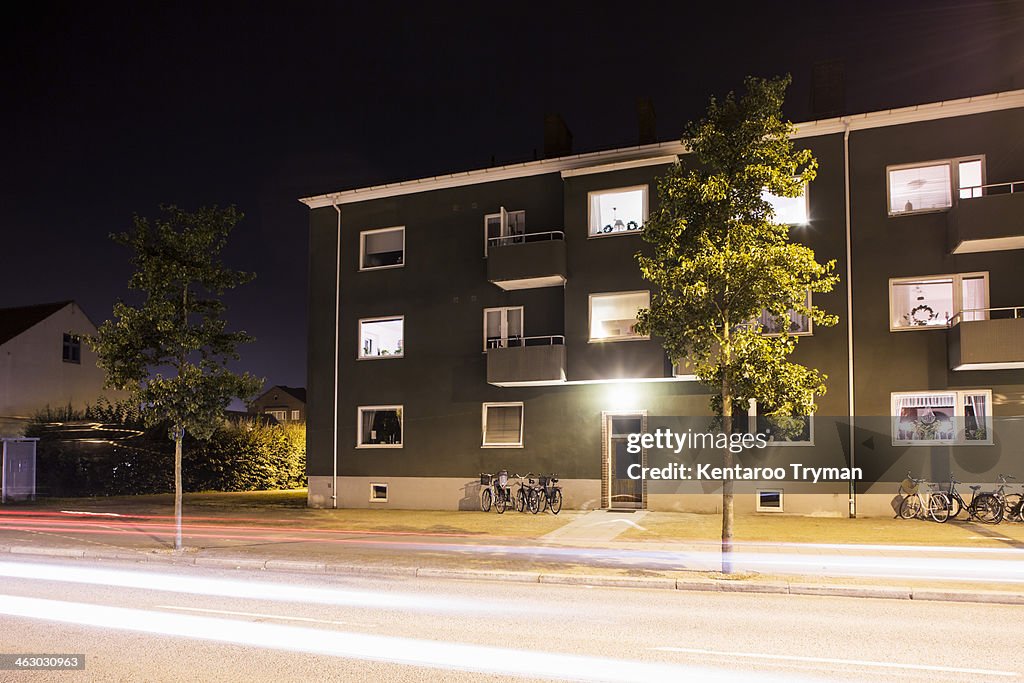 Light trails on street in front of residential building
