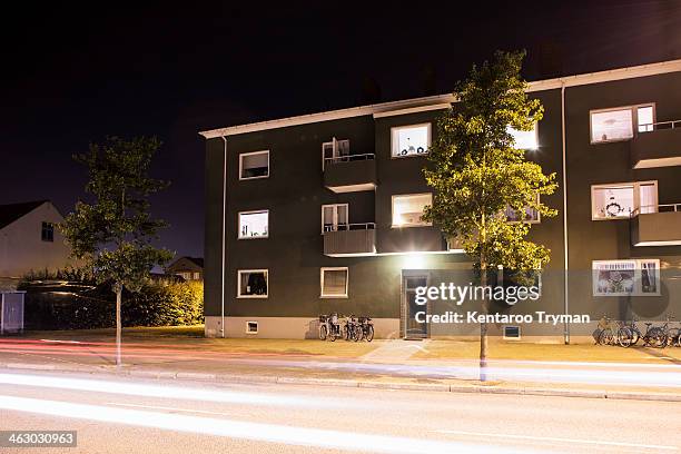 light trails on street in front of residential building - apartment entry stock pictures, royalty-free photos & images