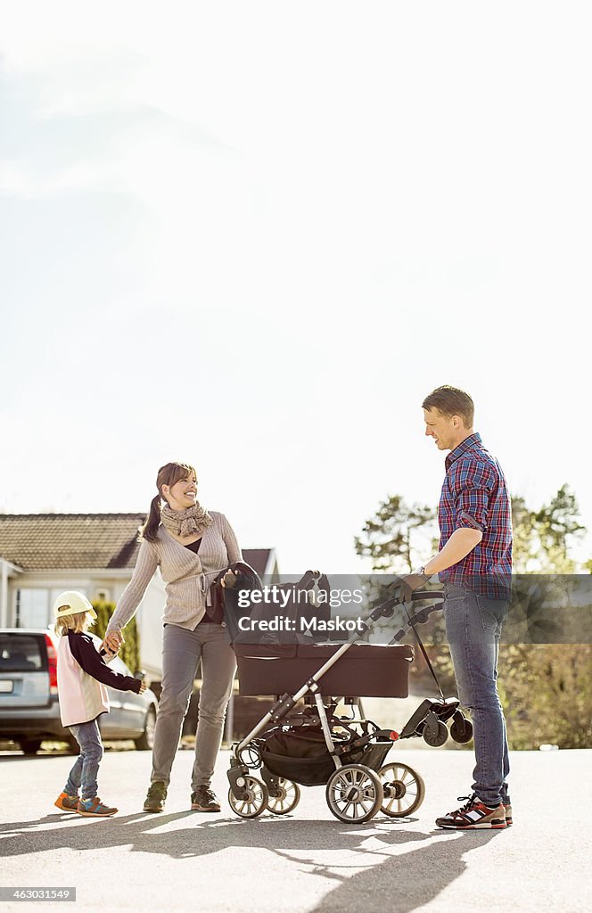 Parents and children on street