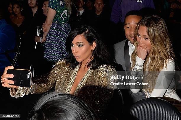 Kim Kardashian, John Legend and Chrissy Teigen take a selfie during The 57th Annual GRAMMY Awards at the STAPLES Center on February 8, 2015 in Los...