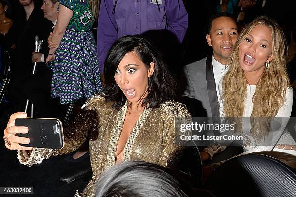 Kim Kardashian, John Legend and Chrissy Teigen take a selfie during The 57th Annual GRAMMY Awards at the STAPLES Center on February 8, 2015 in Los...