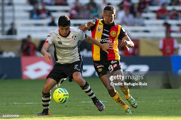 Enrique Perez of Atlas, fights for the ball with Alexander Guerrero of Leones Negros during a match between Leones Negros and Atlas as part of 5th...