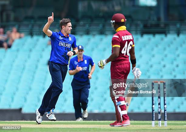 Chris Woakes of England celebrates after taking the wicket of Darren Bravo of West Indies during the ICC Cricket World Cup warm up match between...