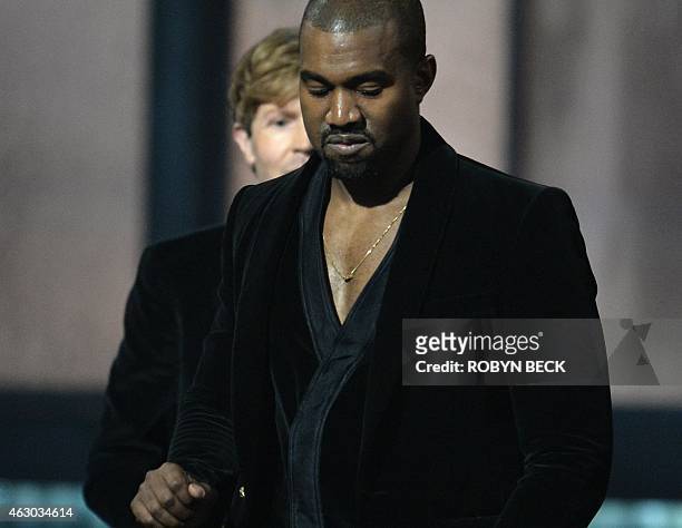 Winner for Album Of The Year Beck reacts as Kanye West leaves the stage at the 57th Annual Grammy Awards in Los Angeles February 8, 2015. AFP PHOTO /...