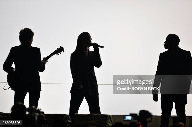 Paul McCartney, Rihanna and Kanye West perform on the stage at the 57th Annual Grammy Awards in Los Angeles February 8, 2015. AFP PHOTO / ROBYN BECK