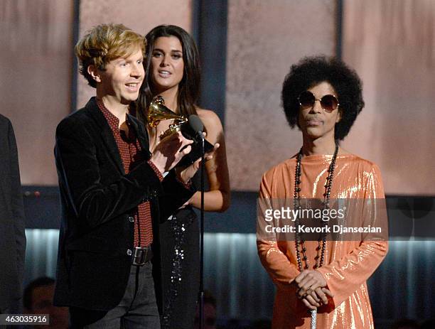 Musician Beck accepts the Album of the Year award for "Morning Phase" from musician Prince onstage during The 57th Annual GRAMMY Awards at the at the...