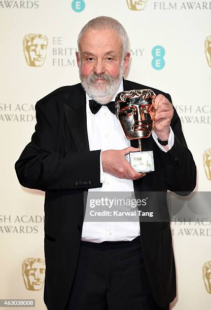 Director Mike Leigh, winner of the Fellowship award, poses in the winners room at the EE British Academy Film Awards at The Royal Opera House on...