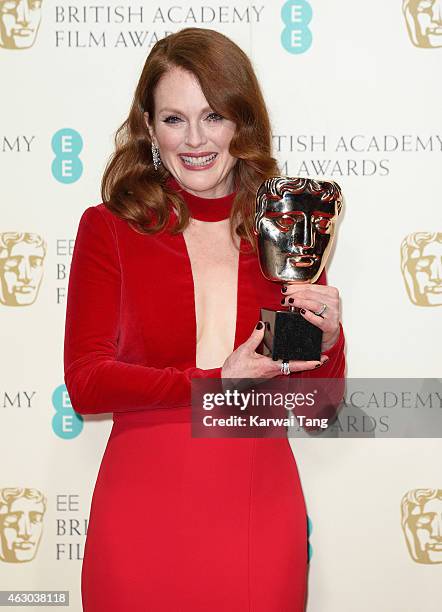 Actress Julianne Moore, winner of the Best Leading Actress award for the movie 'Still Alive' poses in the winners room at the EE British Academy Film...