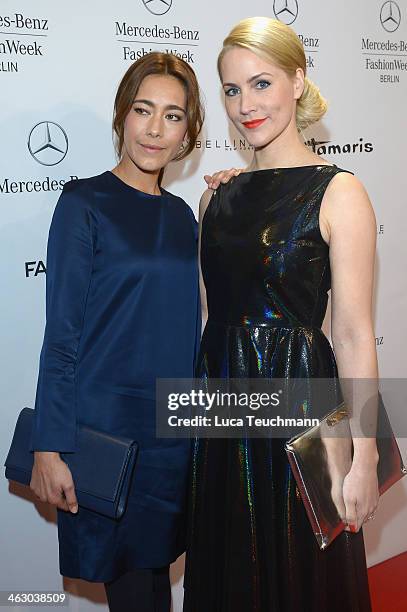 Angela Gessmann and Judith Rakers arrive for the Guido Maria Kretschmer Show during Mercedes-Benz Fashion Week Autumn/Winter 2014/15 at Brandenburg...