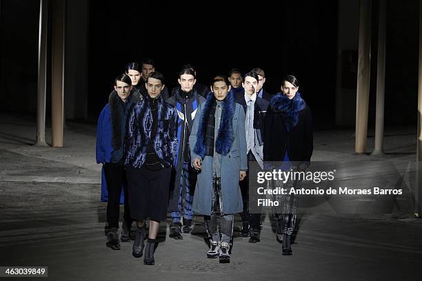 Models walk the runway during the Dries Van Noten Menswear Fall/Winter 2014-2015 show as part of Paris Fashion Week on January 16, 2014 in Paris,...