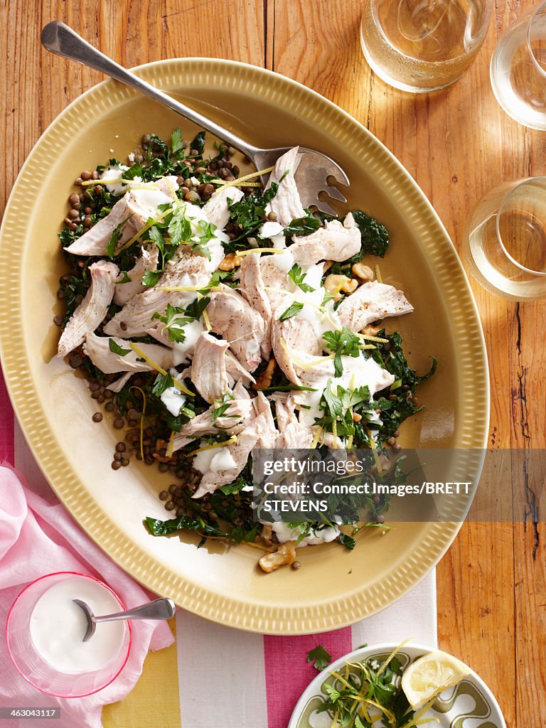 Still life with poached chicken and lentil salad