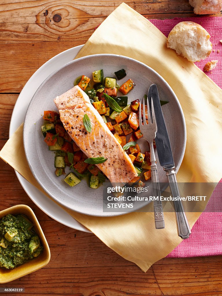 Still life with pan fried salmon and sweet potatoes