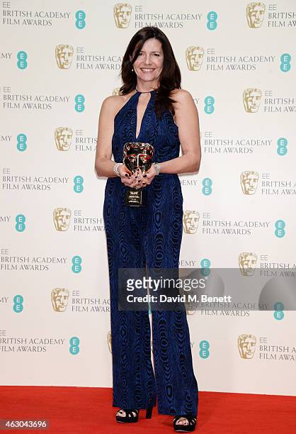 Christine Langan, accepting the Outstanding Contribution To Cinema Award on behalf of BBC Films, poses in the winners room at the EE British Academy...