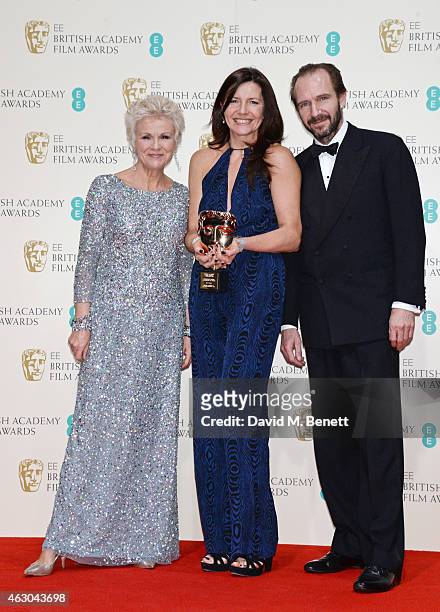 Julie Walters, Christine Langan, accepting the Outstanding Contribution To Cinema Award on behalf of BBC Films, and Ralph Fiennes pose in the winners...