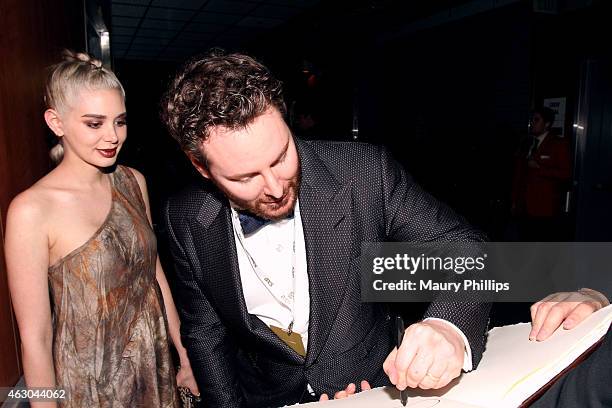 Alexandra Lenas and Sean Parker pose backstage at the GRAMMY Charities Signings during The 57th Annual GRAMMY Awards at the STAPLES Center on...