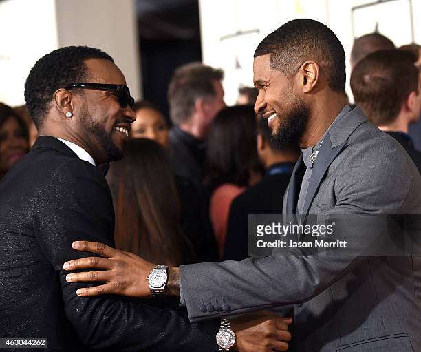 Rapper Juicy J and singer Usher attend The 57th Annual GRAMMY Awards at the STAPLES Center on February 8, 2015 in Los Angeles, California.