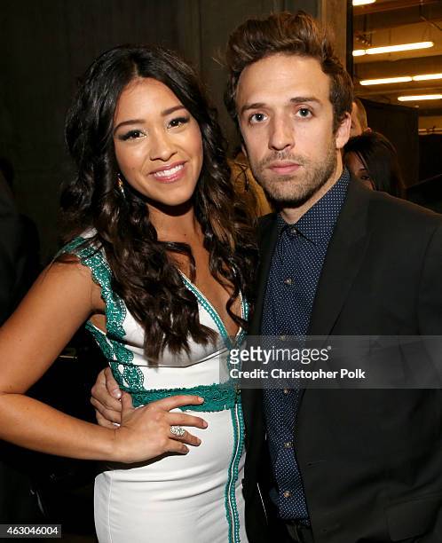 Actors Henri Esteve and Gina Rodriguez attend The 57th Annual GRAMMY Awards at STAPLES Center on February 8, 2015 in Los Angeles, California.