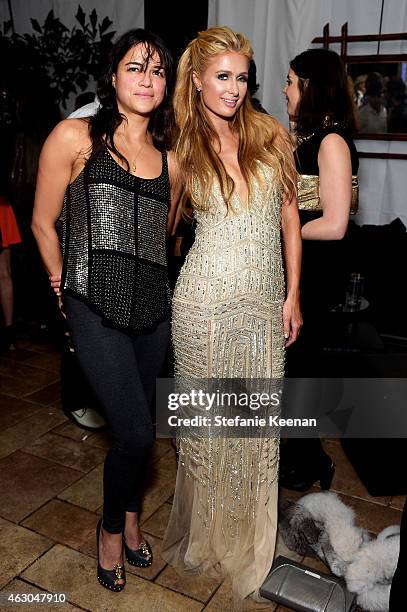 Actress Michelle Rodriguez and Paris Hilton attend the Warner Music Group annual Grammy celebration at Chateau Marmont on February 8, 2015 in Los...