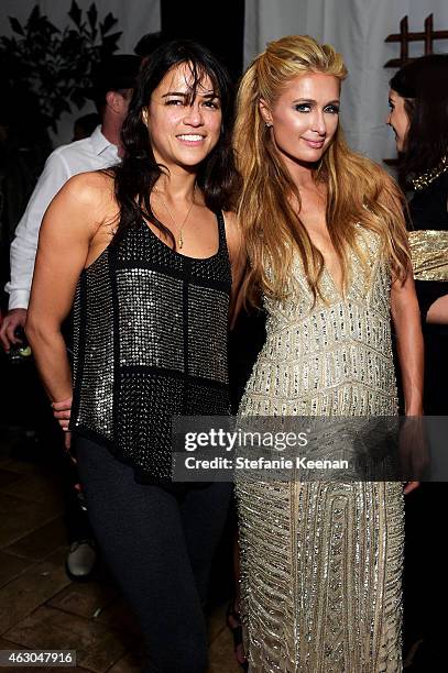 Actress Michelle Rodriguez and Paris Hilton attend the Warner Music Group annual Grammy celebration at Chateau Marmont on February 8, 2015 in Los...