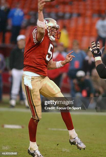 Jeff Garcia of the San Francisco 49ers throws a pass against the New York Giants during the NFC Wildcard game January 5, 2003 at Candlestick Park in...