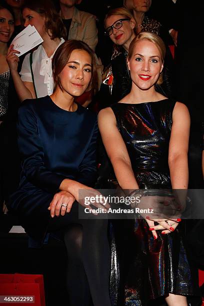 Angela Gessmann and Judith Rakers arrive for the Guido Maria Kretschmer Show during Mercedes-Benz Fashion Week Autumn/Winter 2014/15 at Brandenburg...