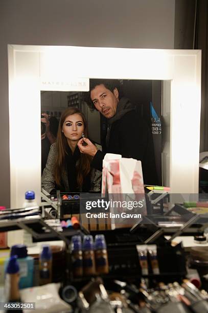 Model is getting styled backstage ahead of the Laurel show during Mercedes-Benz Fashion Week Autumn/Winter 2014/15 at Brandenburg Gate on January 16,...