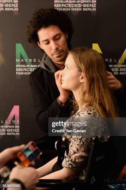 Model is getting styled backstage ahead of the Laurel show during Mercedes-Benz Fashion Week Autumn/Winter 2014/15 at Brandenburg Gate on January 16,...