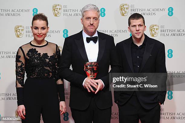 Noomi Rapace and Jesse Eisenberg with Anthony McCarten in the winners room at the EE British Academy Film Awards at The Royal Opera House on February...