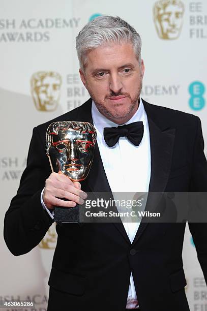 Anthony McCarten poses in the winners room at the EE British Academy Film Awards at The Royal Opera House on February 8, 2015 in London, England.