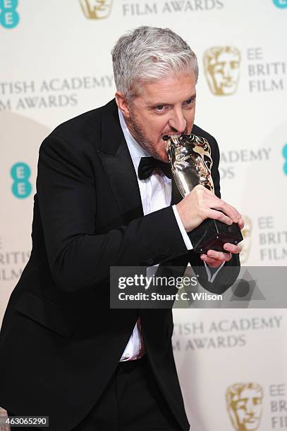 Anthony McCarten poses in the winners room at the EE British Academy Film Awards at The Royal Opera House on February 8, 2015 in London, England.