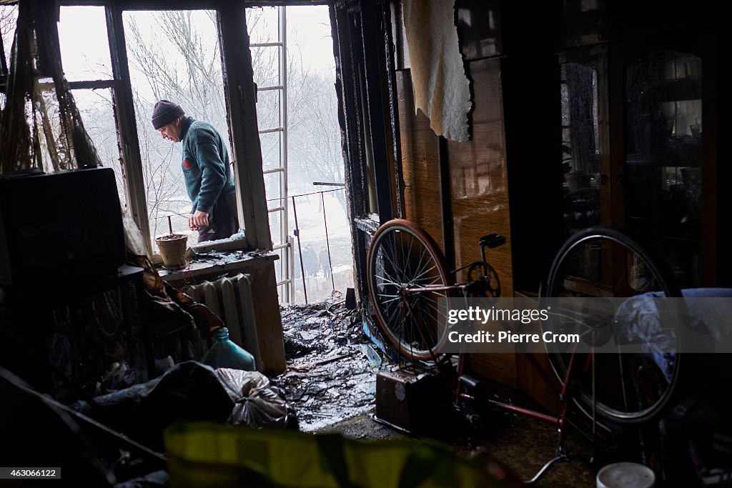 Residents In North Donetsk Clear Out Their Homes Damaged In Artillery Fire