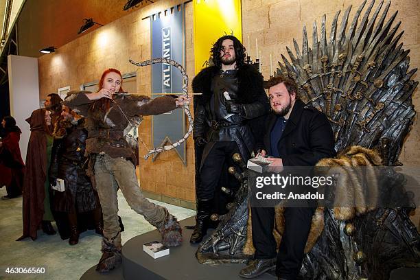 John Bradley signs books of the fans as he opens 'Game of Thrones: The Exhibition' at the O2 in London, England, on February 09, 2015. The exhibition...