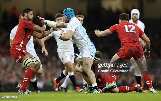 James Haskell of England hands off Toby Faletau of Wales during the RBS Six Nations match between Wales and England at the Millennium Stadium on...