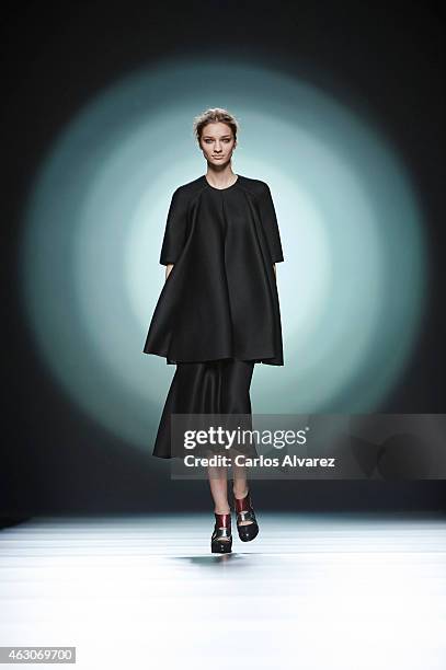 Model walks the runway at the Amaya Arzuaga show during Madrid Fashion Week Fall/Winter 2015/16 at Ifema on February 9, 2015 in Madrid, Spain.