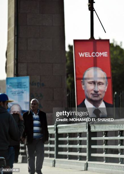 Banner displaying the portrait of Russian President Vladimir Putin and a welcome message is seen erected on Cairo's landmark Qasr al-Nil bridge on...