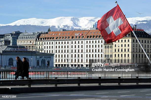 Swiss flag flies above a HSBC logo is seen on HSBC offices on February 9, 2015 in Geneva, Switzerland. It has been discovered that the HSBC bank has...