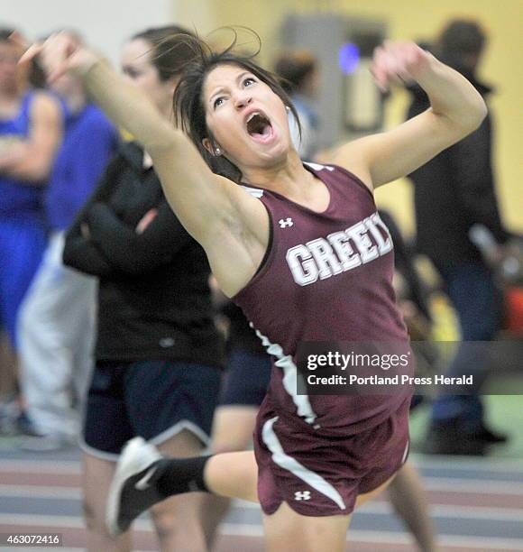 Alyssa Coyne of Greely lets out a yell as she throws the shot about forty feet to win the Senior Shot Put event at the Western Maine Conference...