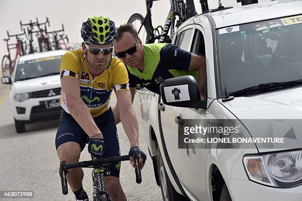Spanish Joaquim Rojas fixes his bike during the second stage of the 2015 Tour of Qatar, from Al Wakra to Al Khor Corniche , on February 9, 2015....