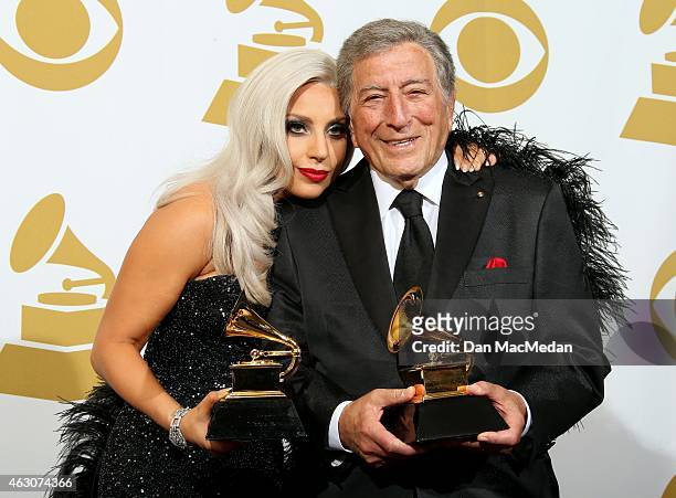 Singers Lady Gaga and Tony Bennett, winners of Best Traditional Pop Vocal Album for 'Cheek to Cheek,' pose in the press room at The 57th Annual...