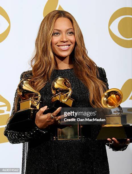 Beyonce poses with her three Grammys in the press room at The 57th Annual GRAMMY Awards at the STAPLES Center on February 8, 2015 in Los Angeles,...