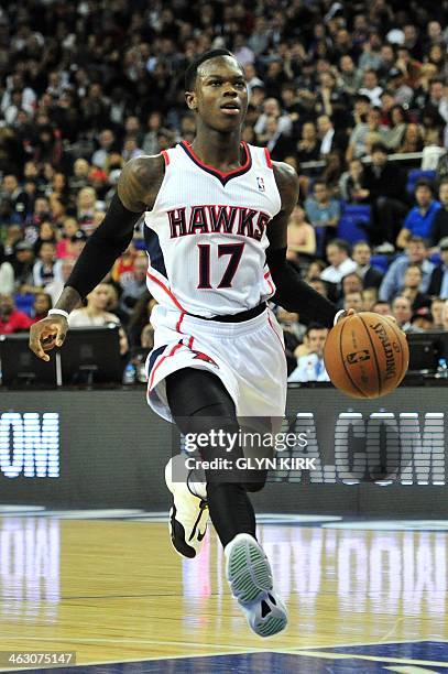 Atlanta Hawks' German player Dennis Schroder dribbles the ball forward during the NBA Global Games London 2014 basketball match between Atlanta Hawks...